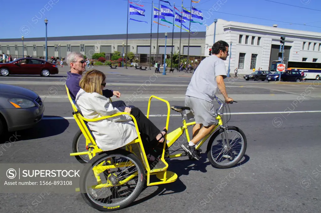 California, San Francisco, The Embarcadero, street scene, pedicab, pedaling, transportation, man, woman, couple, job, tricycle,