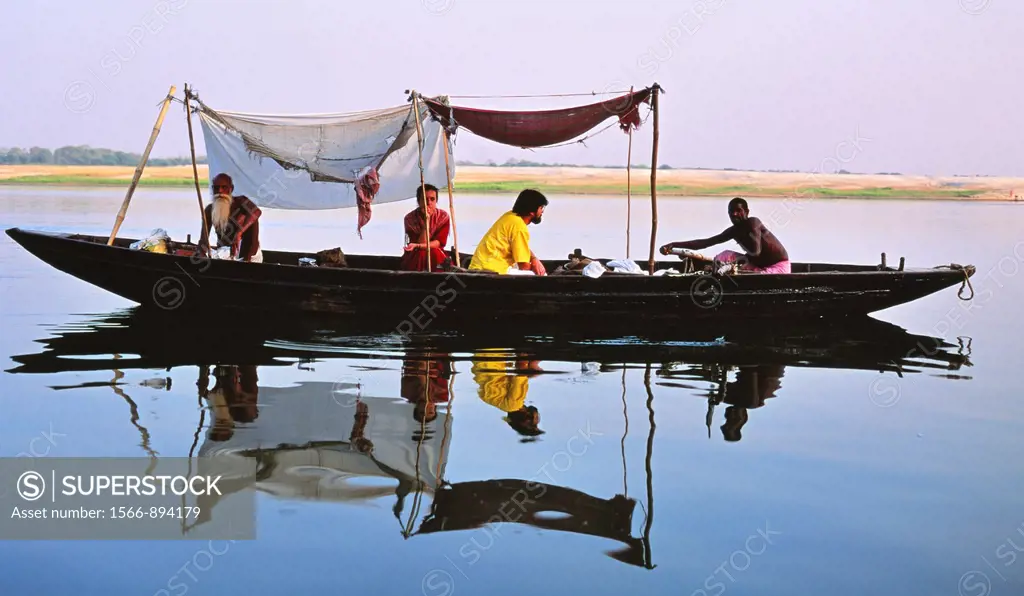 Tourists take a boat trip on the River Ganges, Varanasi, Uttar Pradesh, India
