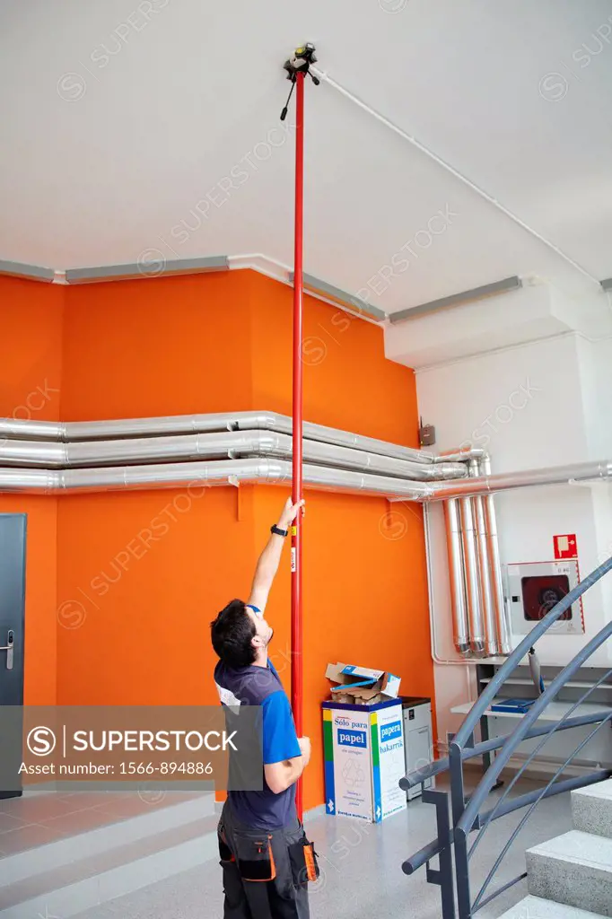 Worker adjusting the fire system, Building , Alava Technology Park, Miñano, Basque Country, Spain