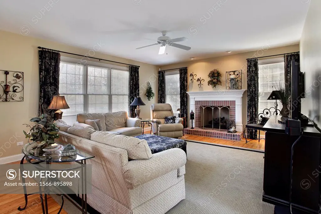 Family room in suburban home with brick fireplace