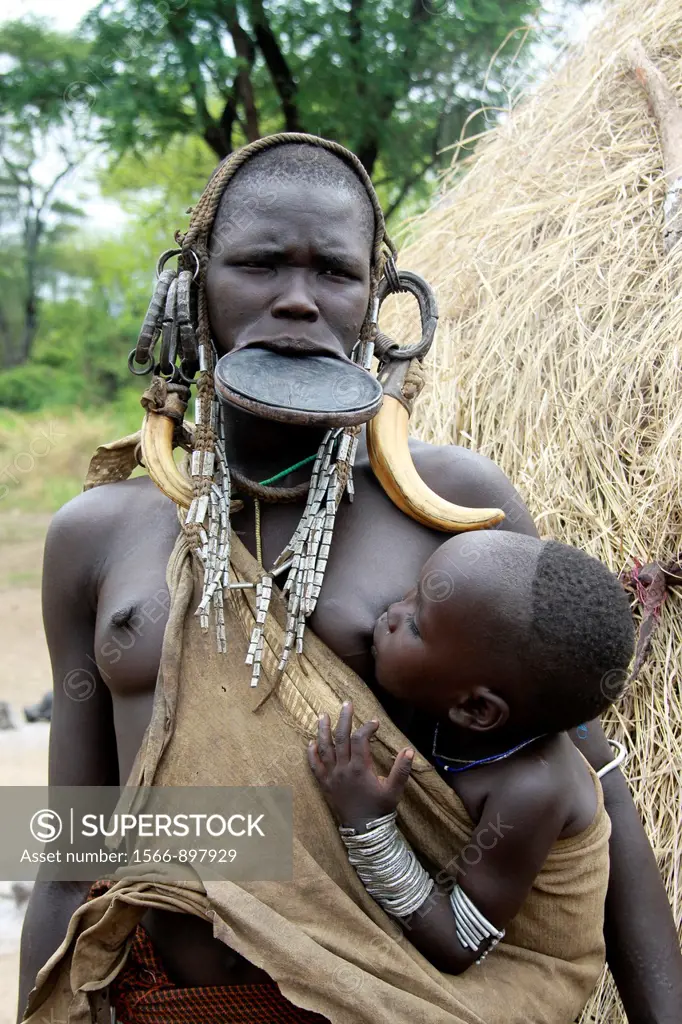 Africa, Ethiopia, Debub Omo Zone, Mursi tribesmen  A nomadic cattle herder ethnic group located in Southern Ethiopia, close to the Sudanese border  Wo...