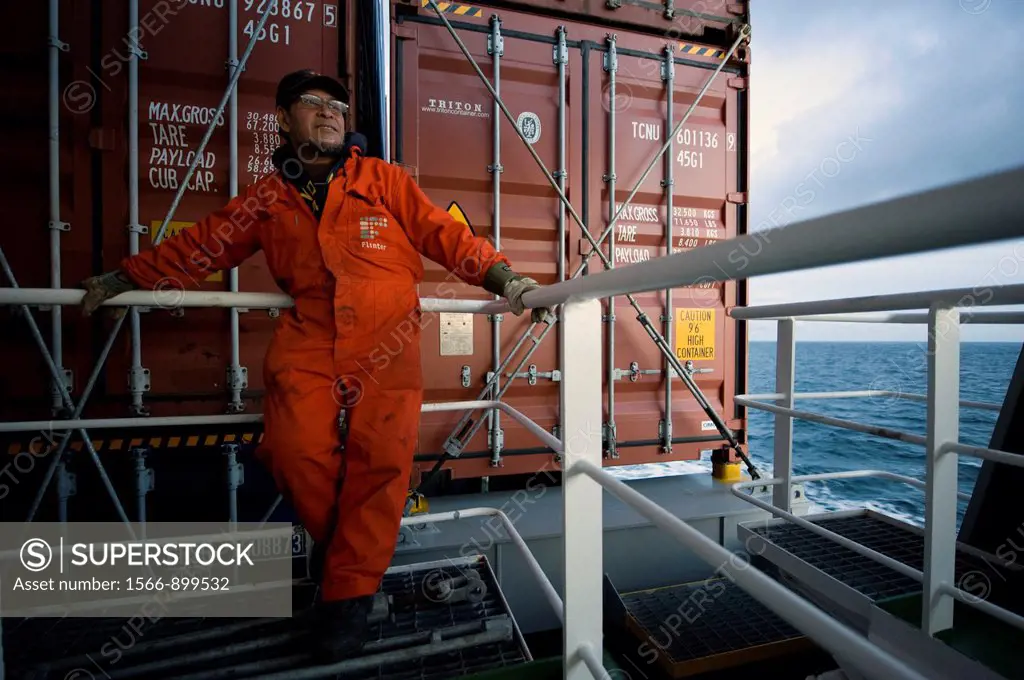 An Indonesian seaman or sailor on the container-vessel MV Flintercape, during a journey from Rotterdam, Netherlands, to Sundsvall, Sweden. The man is ...