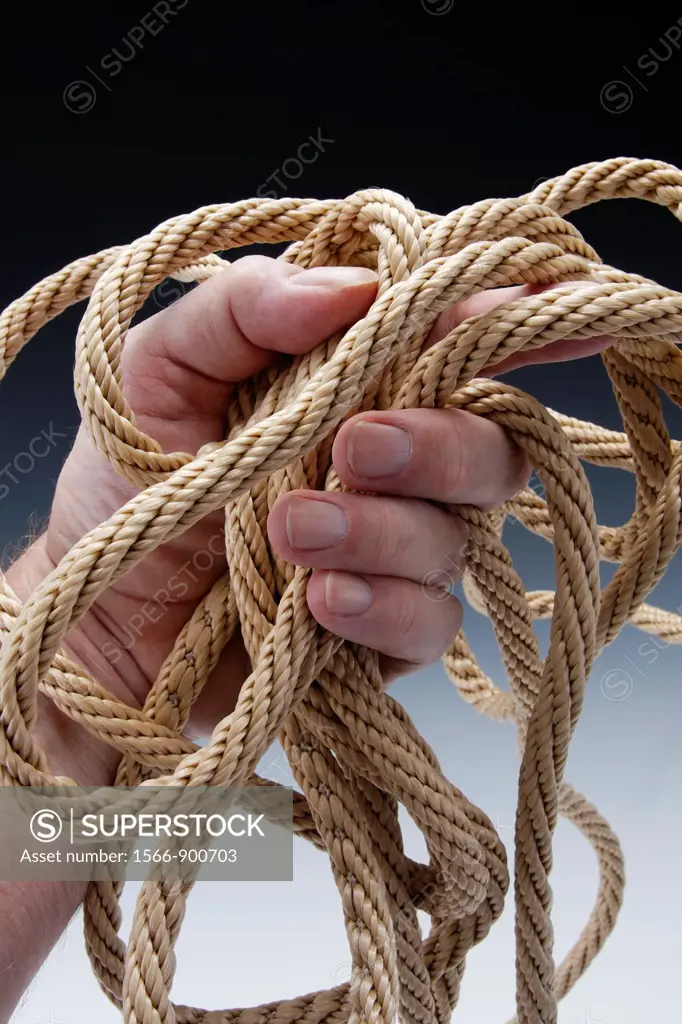 hand clutching natural colored rope