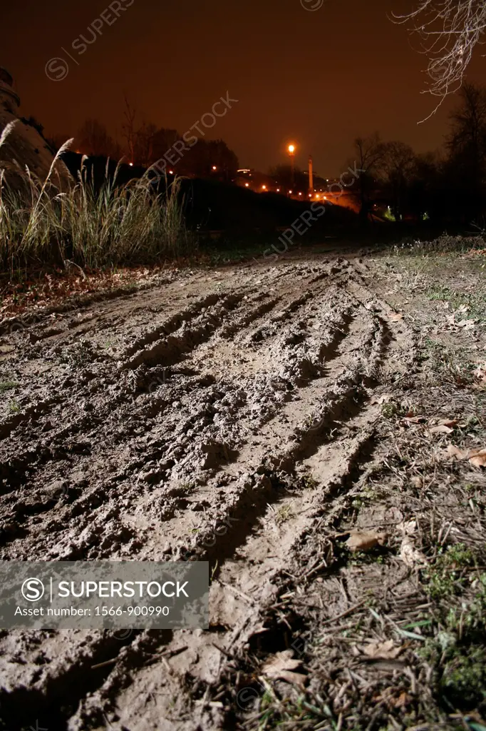 tyre tracks in field at night