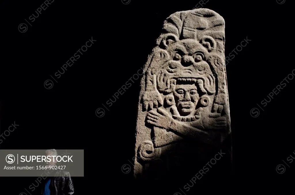 A mature man passes a stone stela displayed in the National Museum of Anthropology in Mexico City, December 1, 2011  The National Museum of Anthropolo...