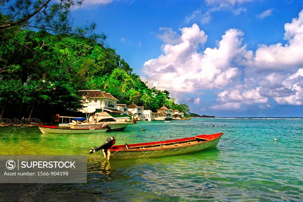 blue lagoon,with red fishing boat, jamaica, caribbean,