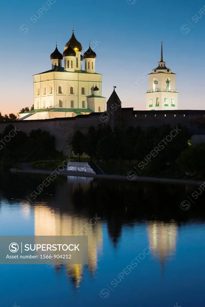 Russia, Pskovskaya Oblast, Pskov, elevated view of Pskov Kremlin and Trinity Cathedral from the Velikaya River, dusk