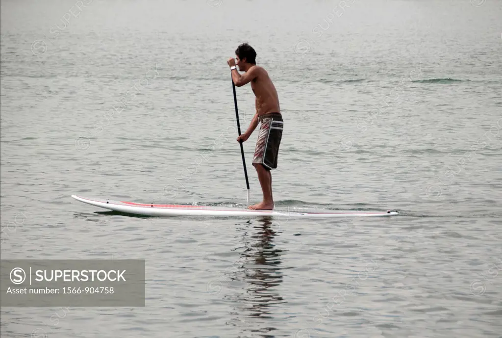 young man surfing, Geneva Lake, Switzerland