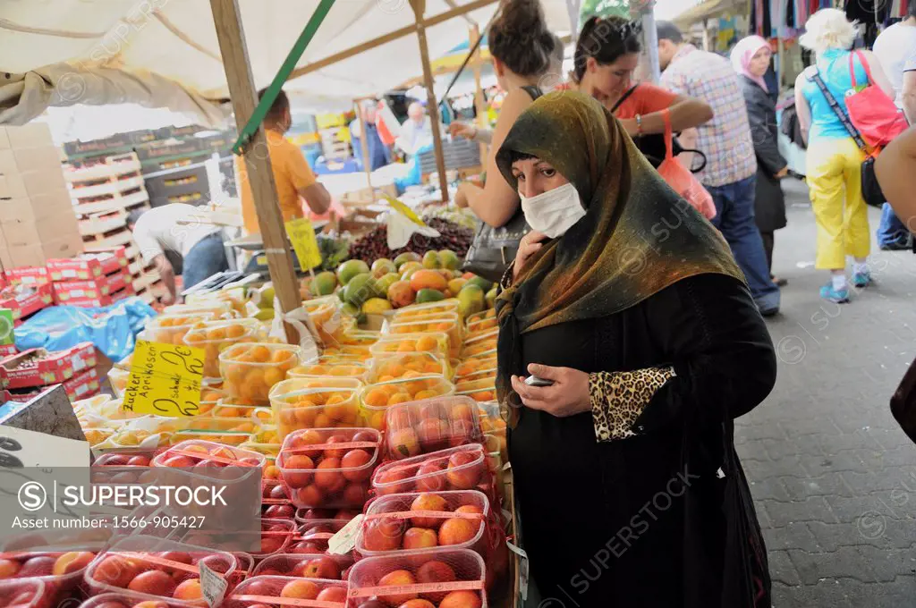 Turks Market at Maybachufer, young turkish woman wearing a headscarf, Kreuzberg, Berlin, Germany