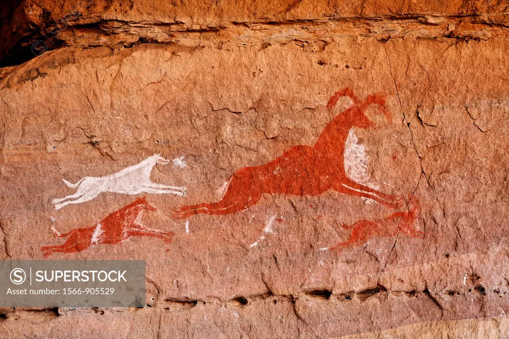 Painted hunting scene, rock art in the Akakus Mountains, Sahara Desert, Libya
