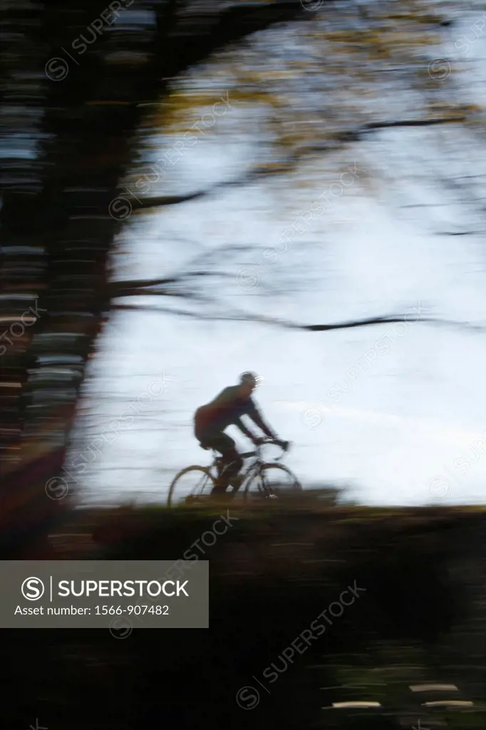 person riding fast bike in countryside in rome italy