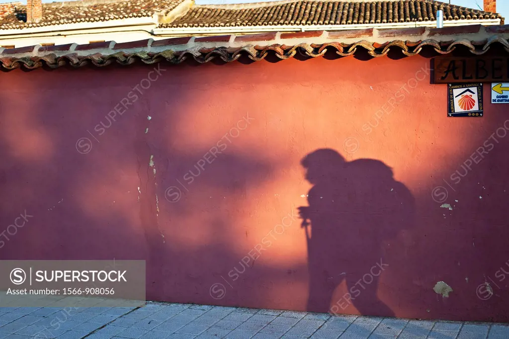 Shadow of a pilgrim on a wall along the Camino de Santiago