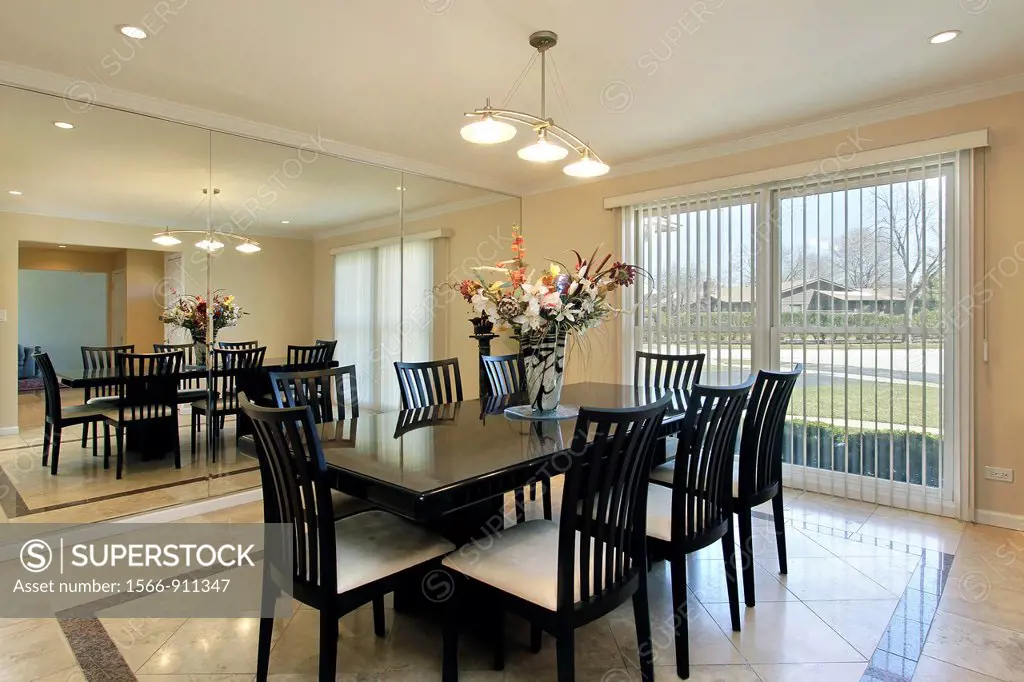 Dining room with black chairs and table