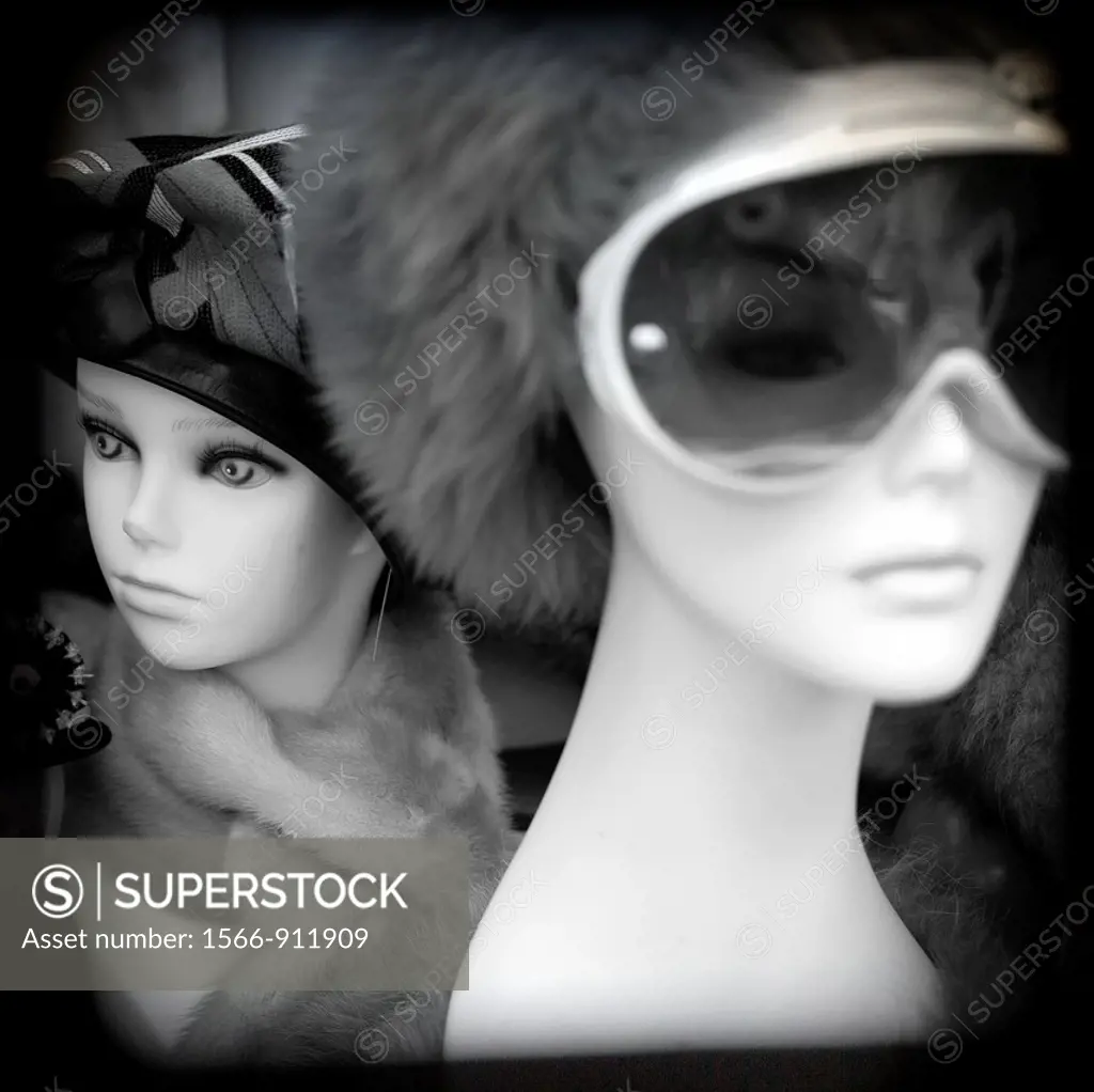 photograph of two busts of women mannequins, one with sunglasses