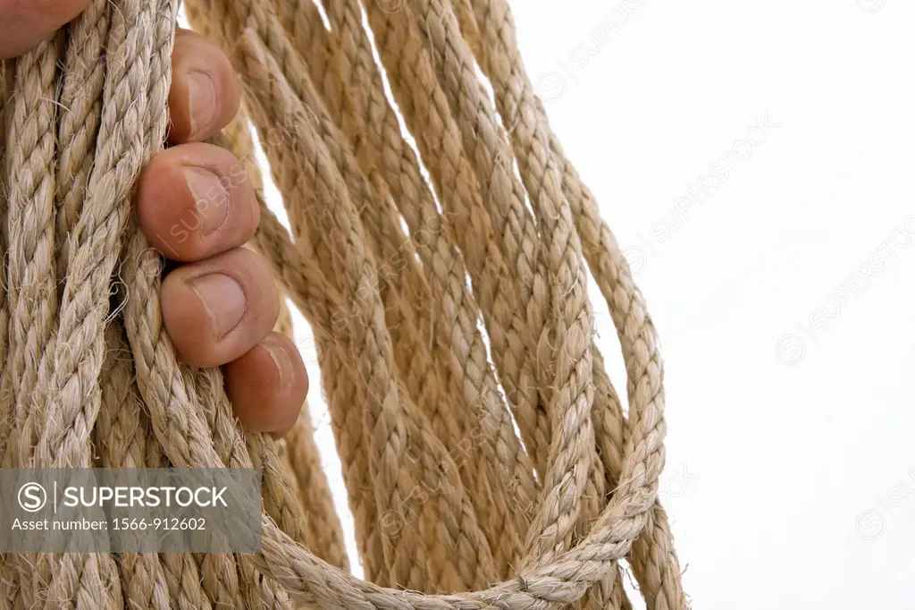 hand clutching natural colored rope