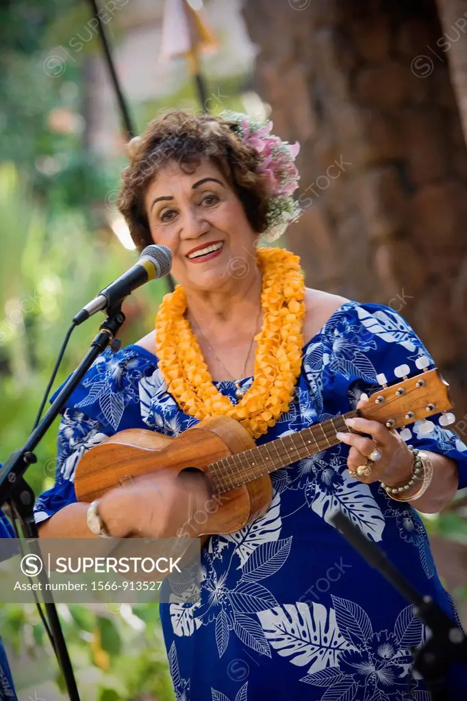 Ukulele player at luau editorial use only, no model release