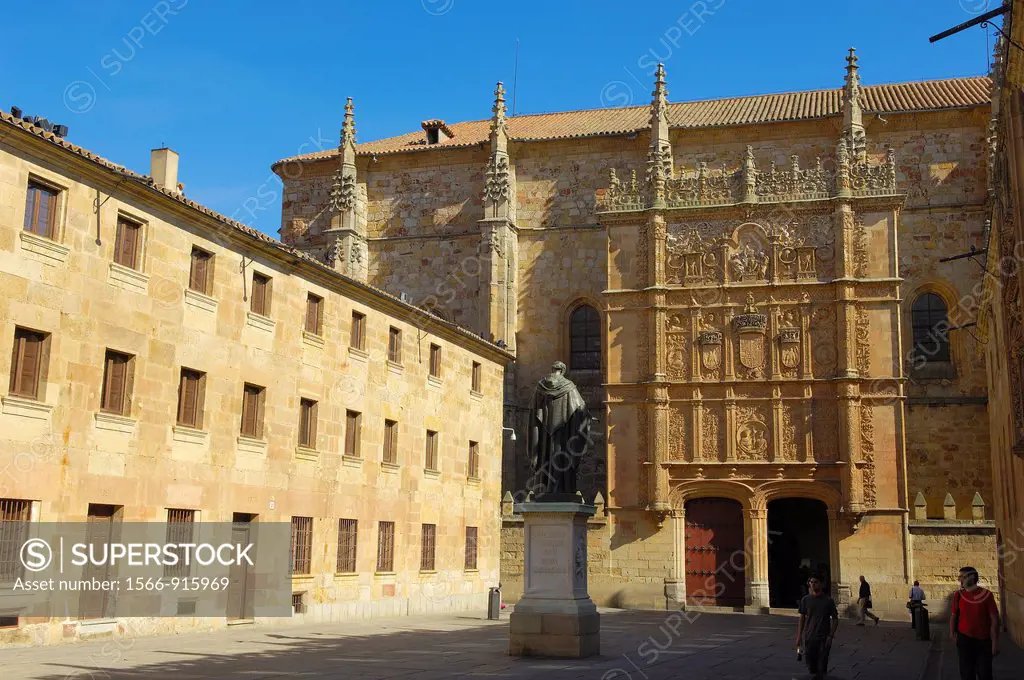 Plateresque facade of the University of Salamanca facing a statue of Fray Luis de León, Salamanca, Castilla-Leon, Spain