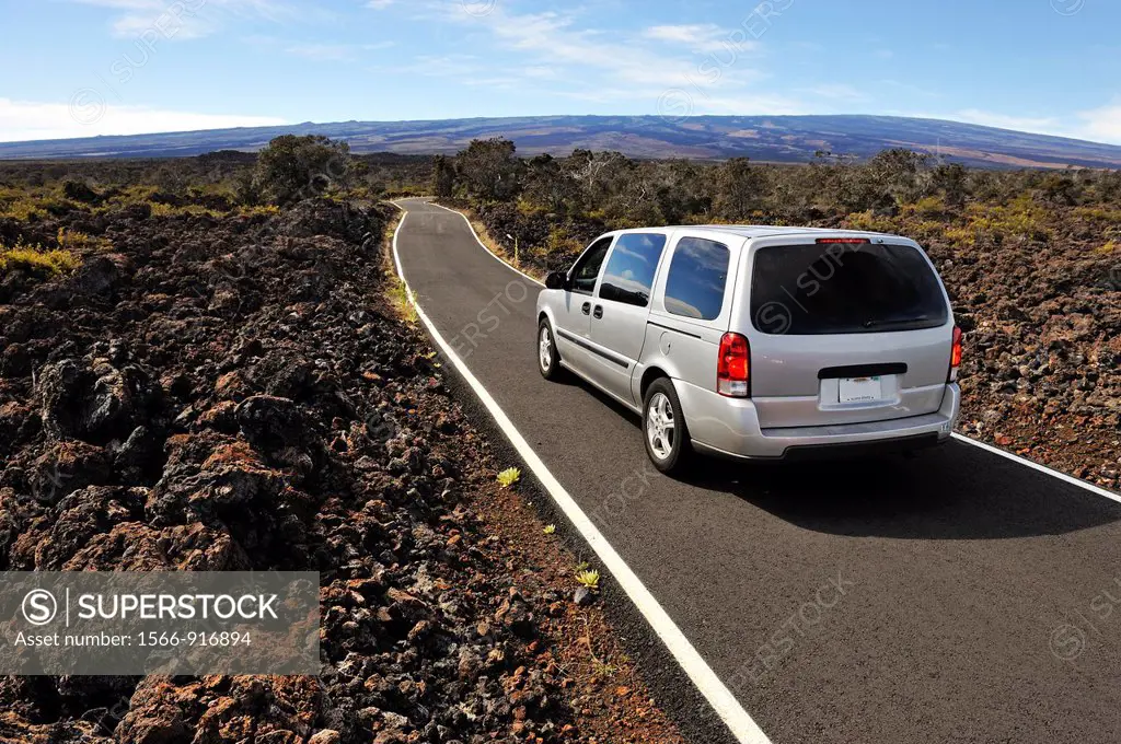 Car on road leading to Mauna Loa Volcano, Big Island, Hawaii Islands, USA