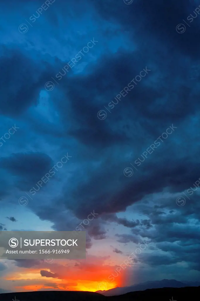 Kyrgyzstan - Toktogul - stormclouds and sunset above mountains