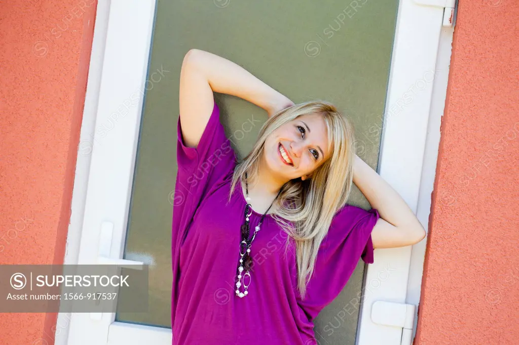 Attractive young woman happy and smiling posing sideways