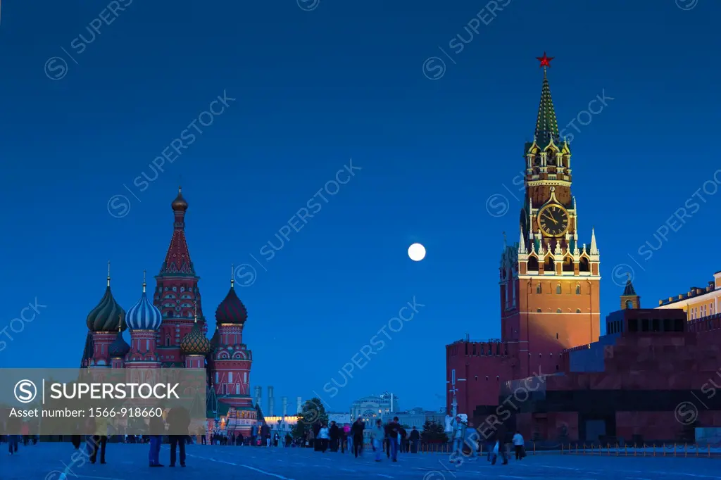 Russia, Moscow Oblast, Moscow, Red Square, Kremlin, Saint Basils Cathedral and Kremlin Spasskaya Tower with moonrise