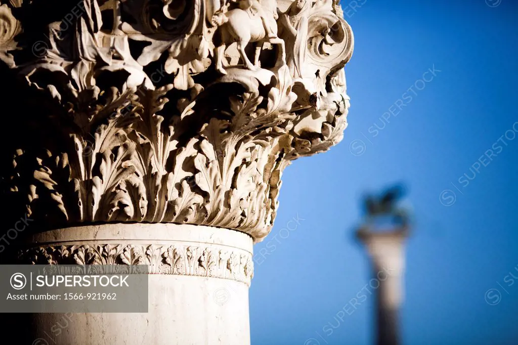 The Piazzetta winged lion background and a column from the Doge´s Palace foreground, Venice, Italy