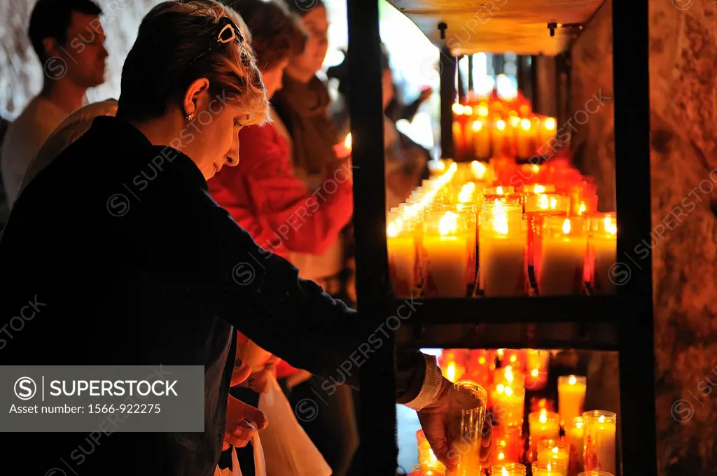 Spain, Asturias, Picos de Europa National Park, Covadonga, Pilgrims lighting candles near the shrine of the virgin Mary   Legend has it that in the 8t...