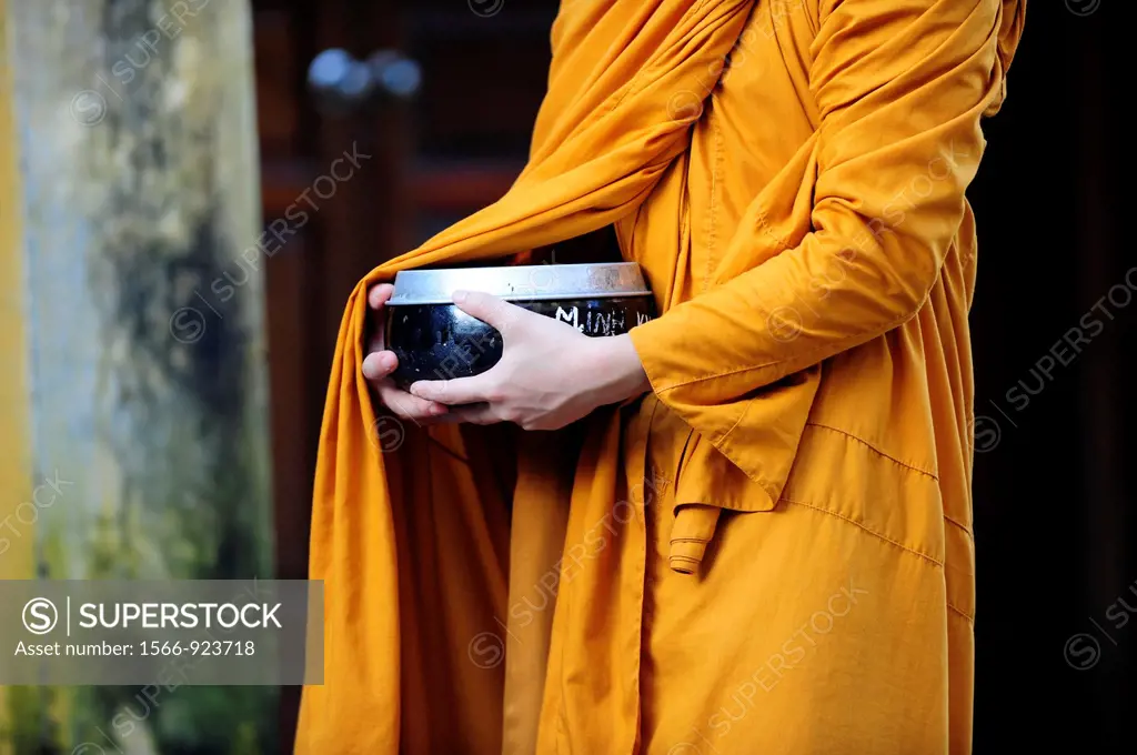 Asia,South East Asia,Vietnam,close-up of hands of a monk holding a bowl