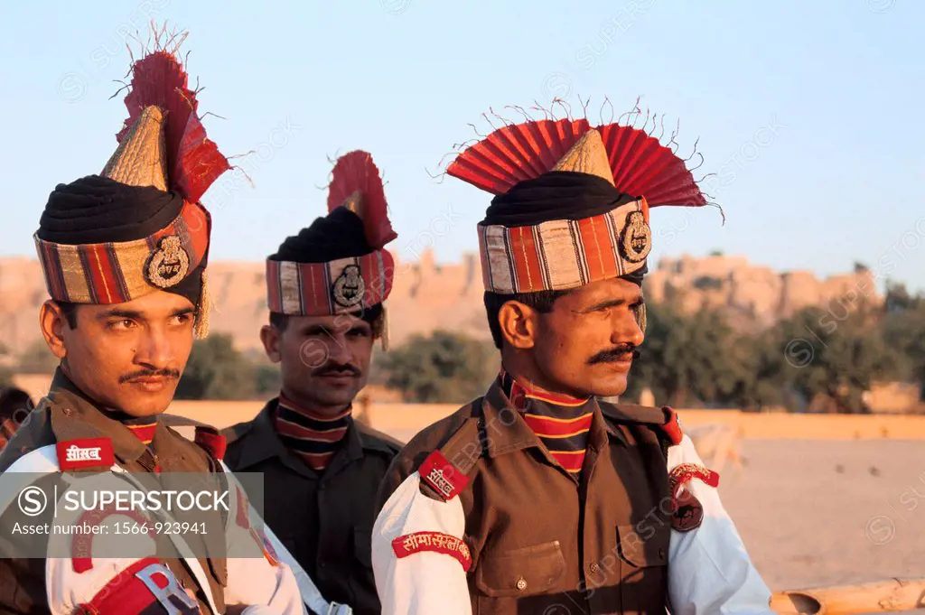 Soldiers belonging to the Border Security Force in ceremonial dress  In the background, the fort of Jaisalmer  From Rajasthan, India