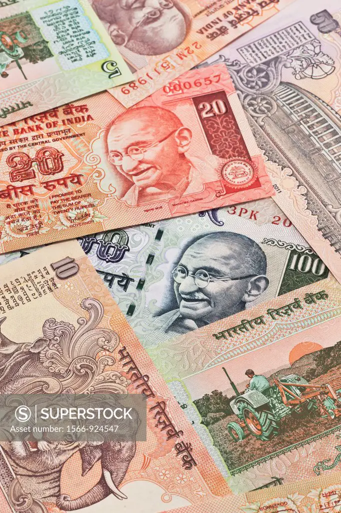 Many Indian rupees bills with the portrait of Mahatma Gandhi lying side by side, India, Asia