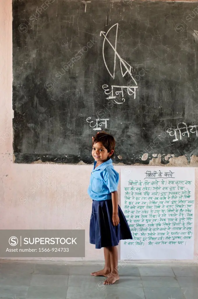 Little girl in front of blackboard, Village school near Jaipur, Rajasthan, India