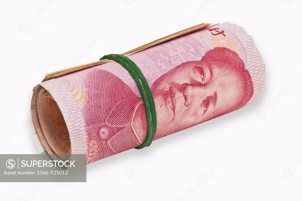 Many 100 Yuan bills, rolled up and held together with a rubber The renminbi, the Chinese currency, was introduced in 1949 after the founding of the Pe...