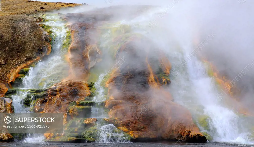 Run off from the hot spring, Excelsior Geyser, produces a variety of colors from the microorganisms and thermophiles that live within, at Yellowstone ...