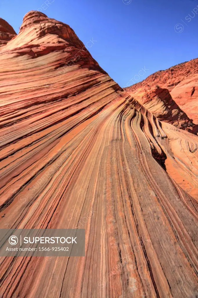 Parallel lines in the slickrock make up the landscape at The Wave at Coyote Buttes North at the Vermillion Cliffs National Monument in Arizona