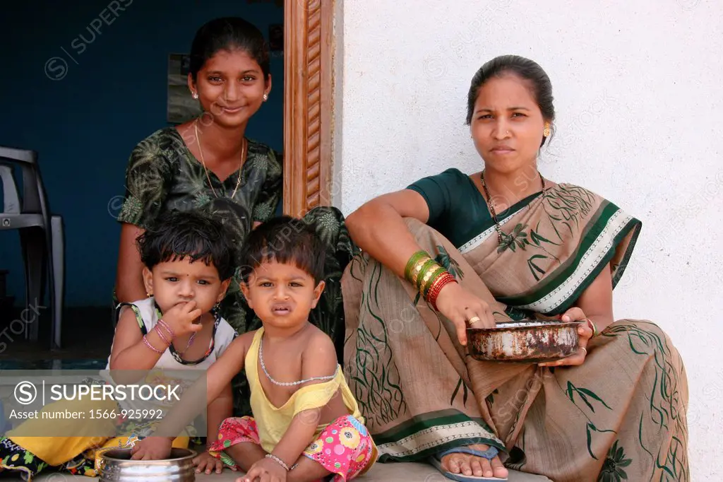 Family outside their house india
