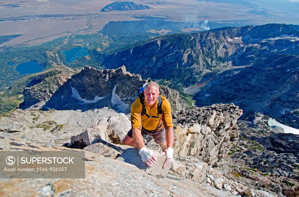 Free solo rock climbing The Direct South Ridge route which is rated grade 3 at 5,7 on Nez Perce Peak in Grand Teton National Park in northern Wyoming