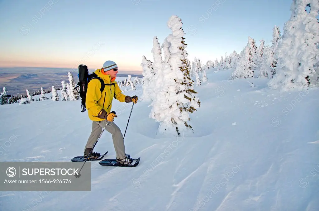 Snowshoeing on Mount Harrison high in the Albion Mountains above the city of Albion in southern Idaho
