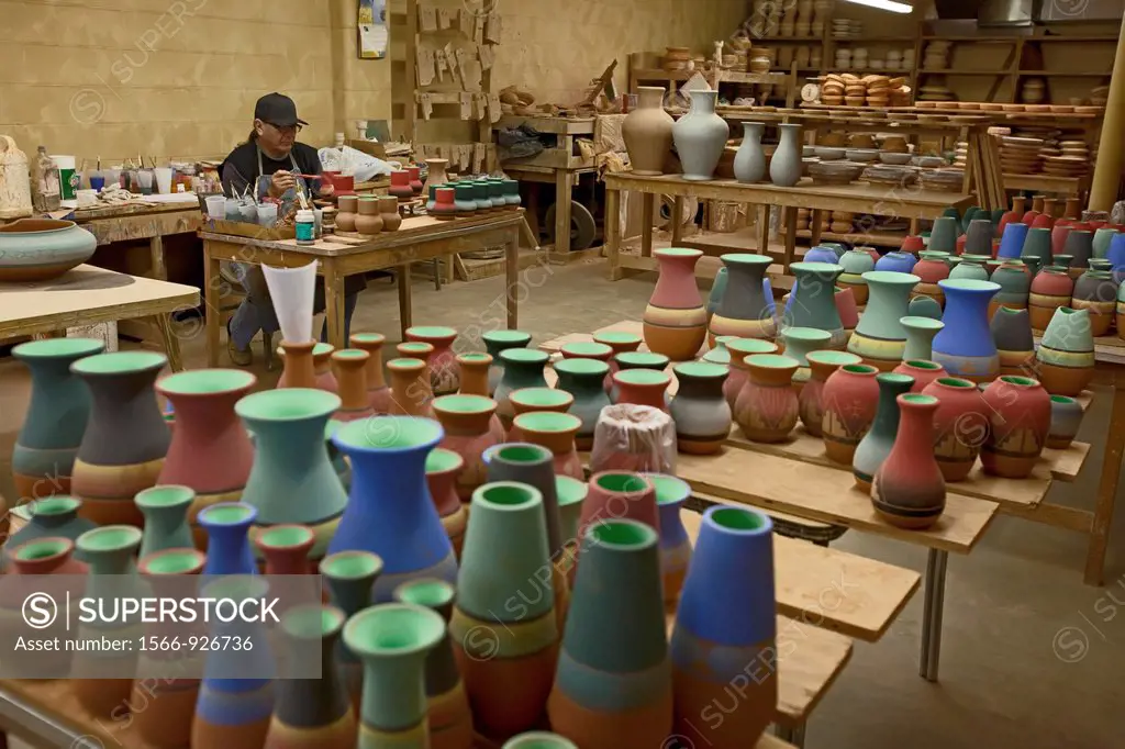 Rapid City, South Dakota - Del Loefer, a member of the Rosebud Sioux, creates pottery at Sioux Pottery