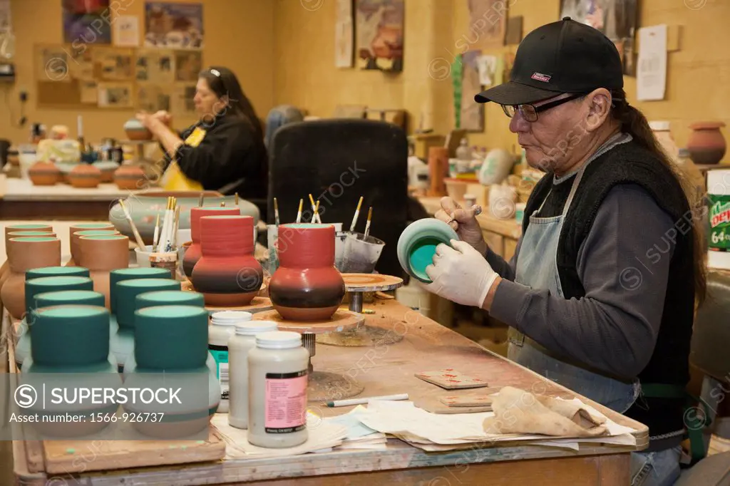 Rapid City, South Dakota - Del Loefer, a member of the Rosebud Sioux, creates pottery at Sioux Pottery