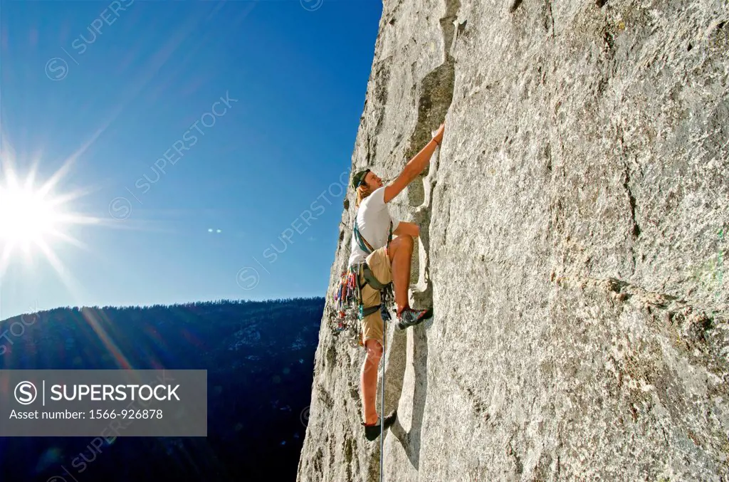 Rock climbing a route called Corrugation Corner which is rated 5,7 and located at Lovers Leap near Lake Tahoe in northern California