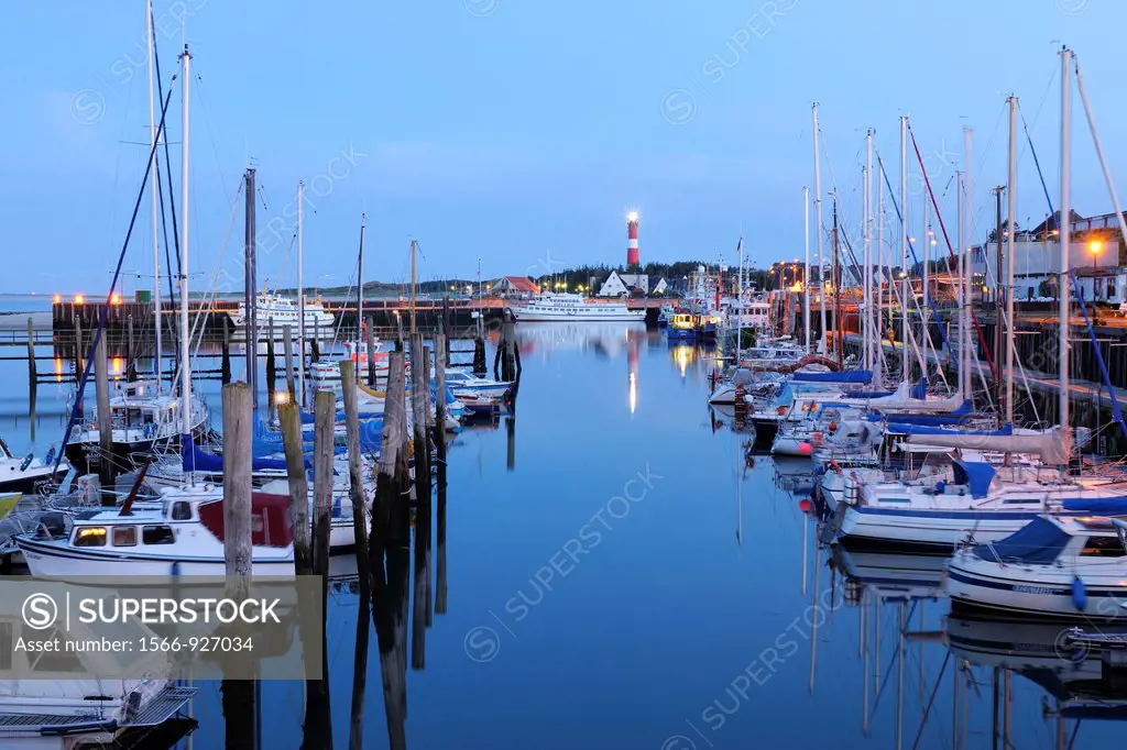 Harbour with sailing boats and lighthouse at dusk, Germany, Schleswig Holstein, Sylt, North Frisian Islands, Hörnum, North Sea