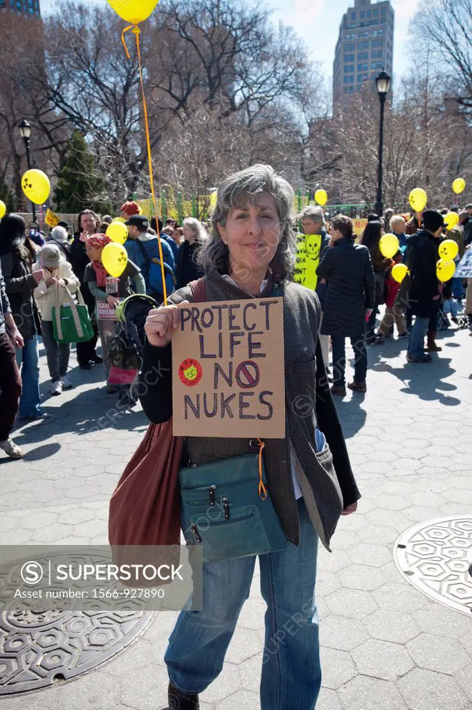 On the first anniversary of the Fukushima nuclear plant disaster in Japan, Sunday, March 12, 2012, activists in New York gather in Union Square Park t...