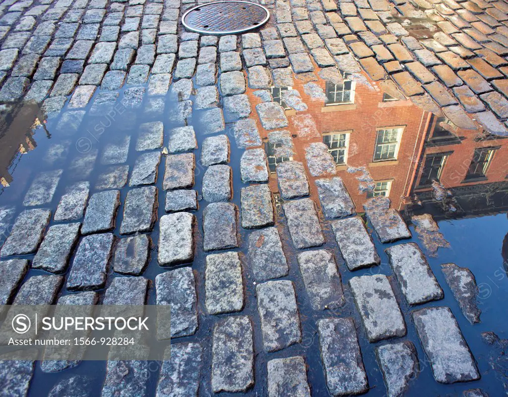 A detail of a street in the West Village neighborhood of New York paved with Belgian Blocks Streets in New York City were never paved with cobblestone...