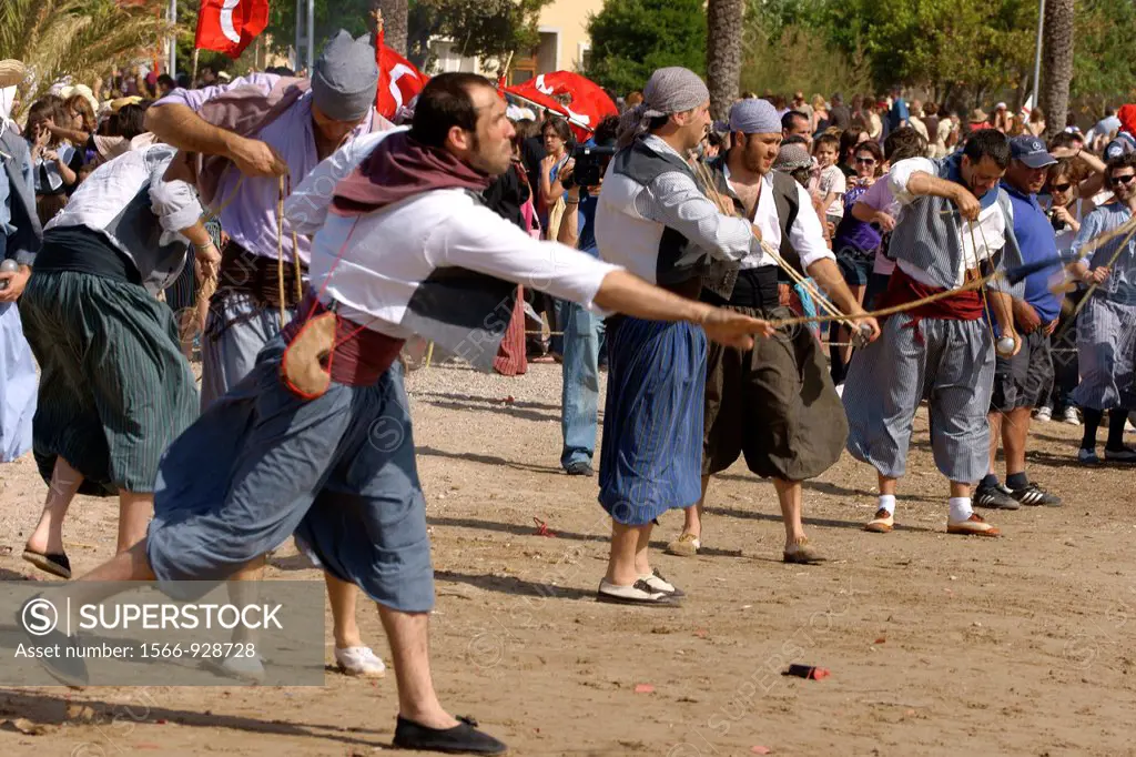 Battle on the beach den Repic.Moors Christians, Christian commemoration of the victory over the Turks in 1561. It Firó, Soller, Majorca, Balearic Isla...