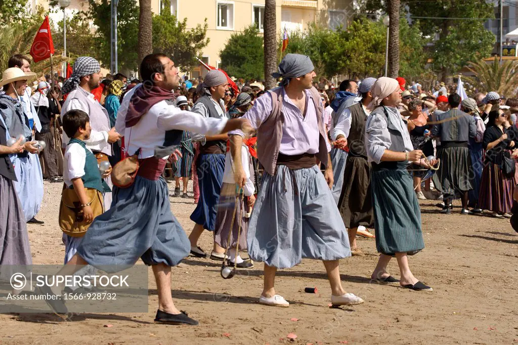 Battle on the beach den Repic.Moors Christians, Christian commemoration of the victory over the Turks in 1561. It Firó, Soller, Majorca, Balearic Isla...