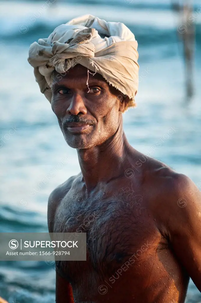 portrait of a stilt fisherman in Midigama, Sri Lanka