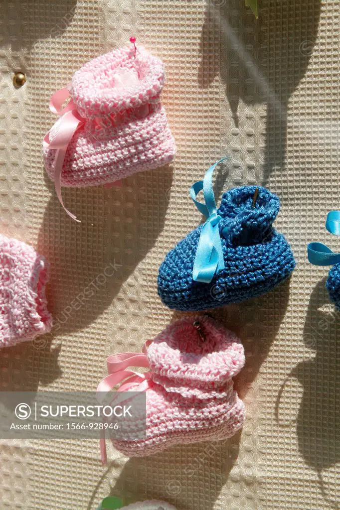 woollen baby bootees in shop window