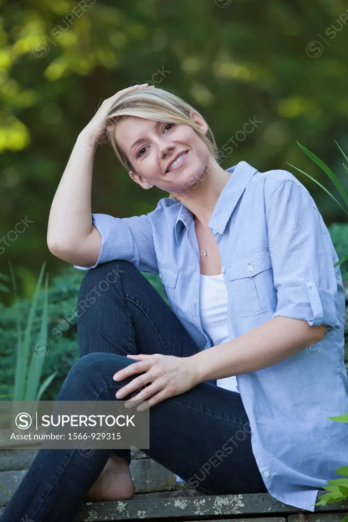 woman sitting outdoors portrait