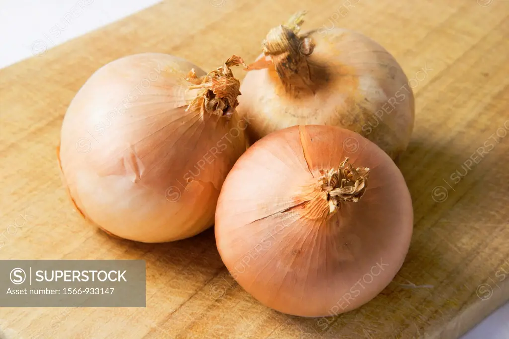 Organic Onions on a Chopping Board