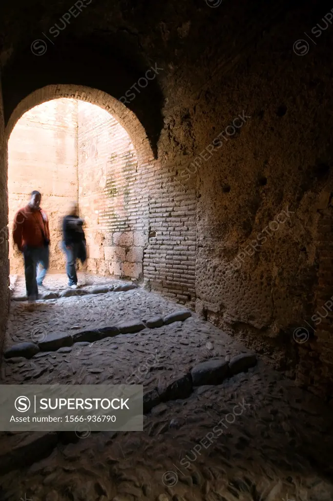 Couple of visitors inside Alcazaba, Alhambra, Granada, Spain